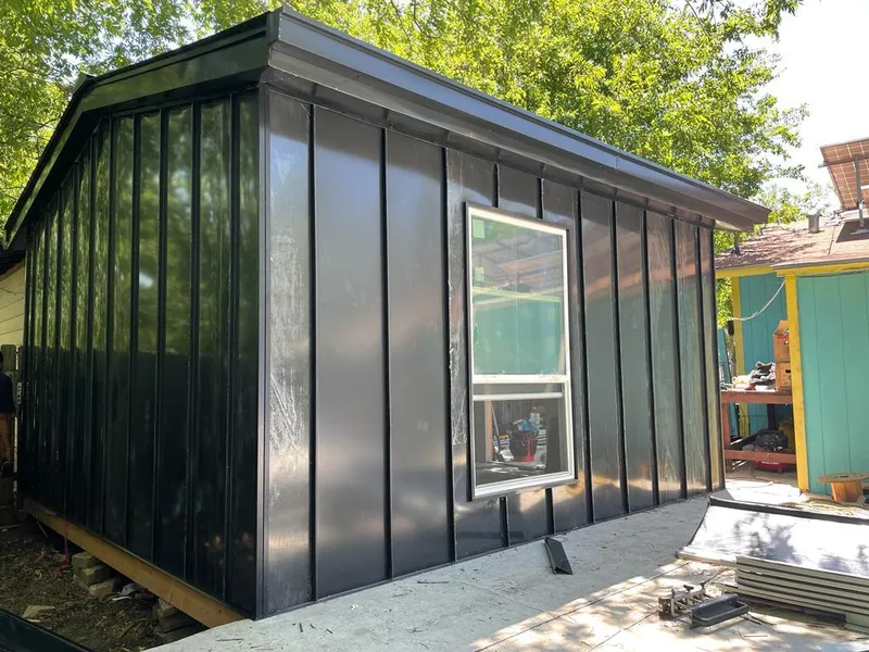 Black standing seam metal wall panels for Metal Roof Installation in Arbutus